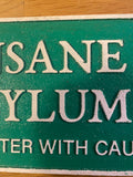 Cast Metal Insane Asylum  sign