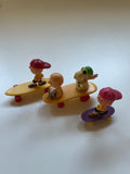 Set of 3 snoopy toys - skateboarders