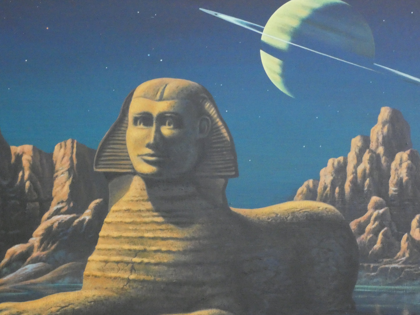 “Sci-Fi Sphinx by David A. Hardy – Vintage 1970s Space Art Print (100 × 58.8 cm) | Surreal Ringed Planet Landscape”