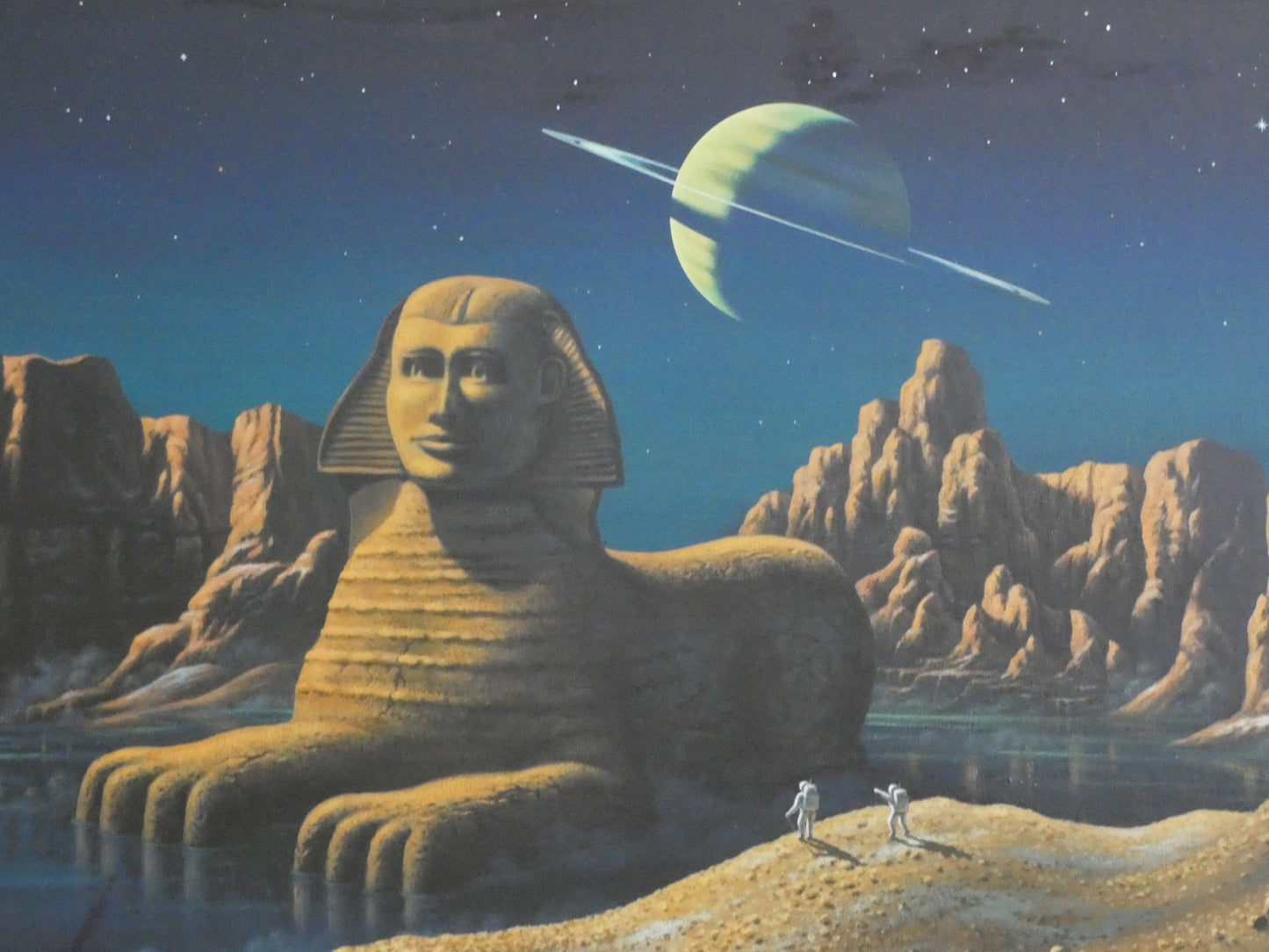 “Sci-Fi Sphinx by David A. Hardy – Vintage 1970s Space Art Print (100 × 58.8 cm) | Surreal Ringed Planet Landscape”