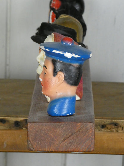 Set of Vintage French Folk Art Puppet Heads on Wooden Stand